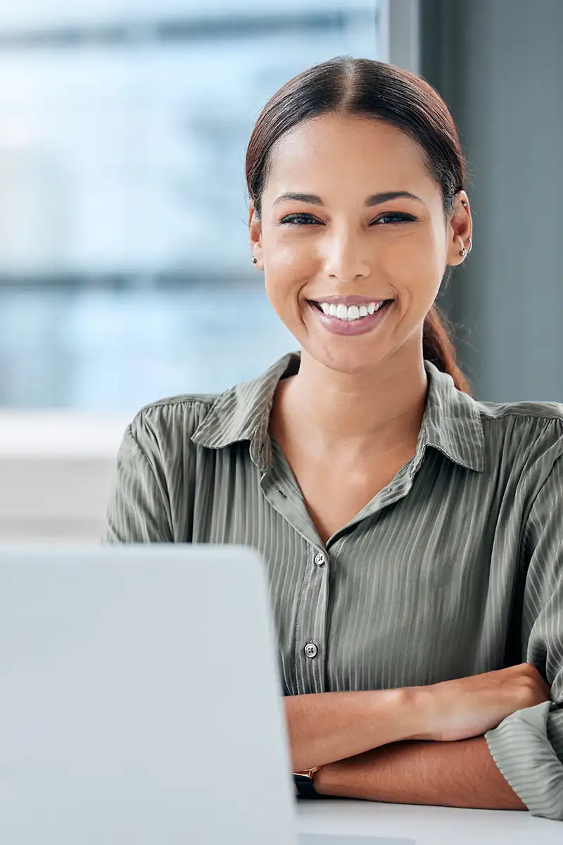portrait-of-a-young-businesswoman-working-on-a-lap-2023-11-27-05-06-48-utc.webp